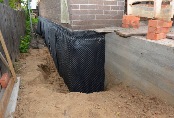 SJ Waterproofing Pros technician performing targeted Sump Pump Installation assessment in Goodwater, AL